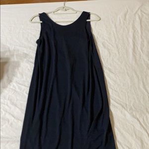 Black cotton open back dress.